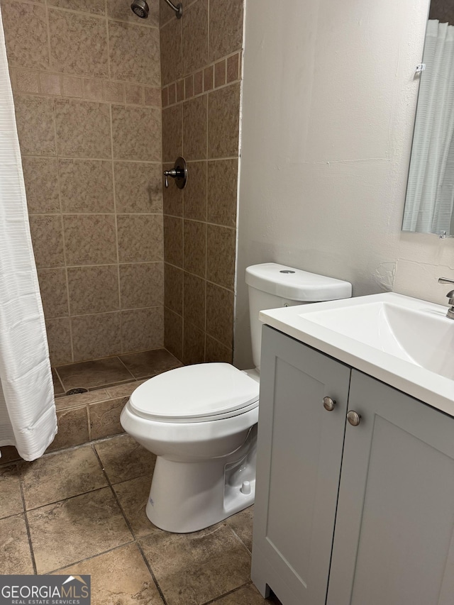 bathroom with vanity, toilet, and a shower with curtain