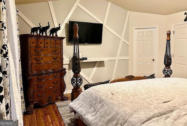 bedroom featuring hardwood / wood-style floors