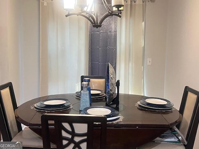 dining room with a chandelier