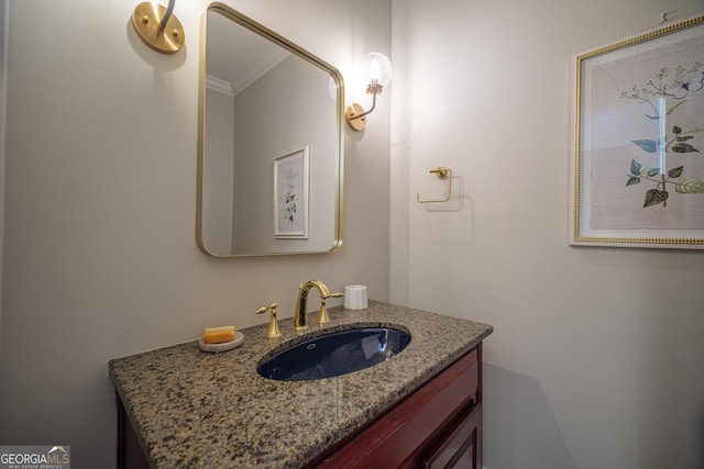 bathroom featuring crown molding and vanity