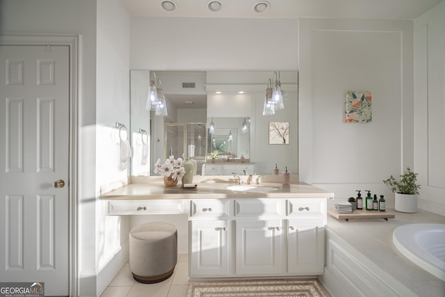 bathroom featuring tile patterned flooring, shower with separate bathtub, and vanity