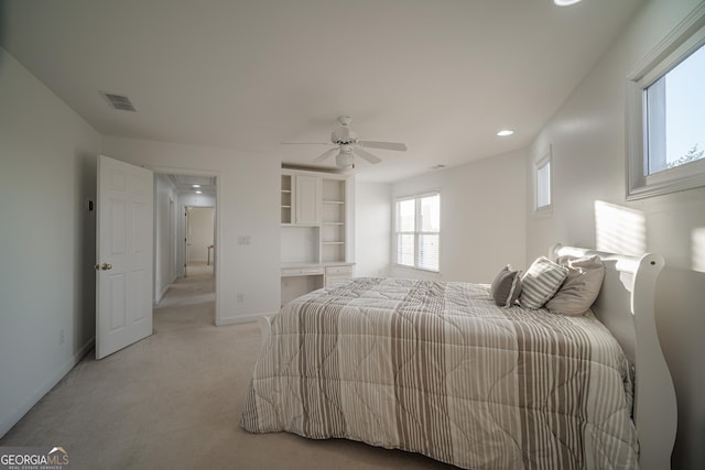 carpeted bedroom with ceiling fan