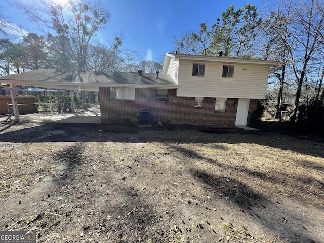 back of property with a carport