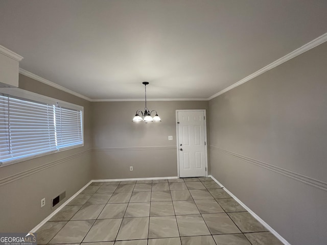 unfurnished dining area featuring ornamental molding, a chandelier, and light tile patterned floors