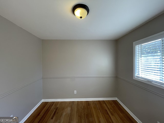 spare room featuring hardwood / wood-style floors