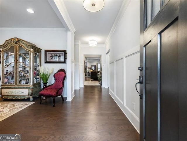 foyer featuring crown molding and dark hardwood / wood-style floors