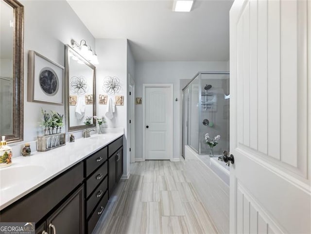 bathroom with shower with separate bathtub and vanity