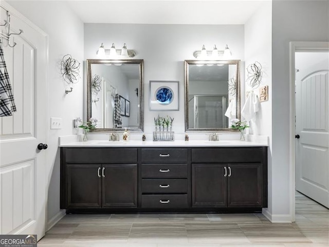 bathroom with vanity and a shower