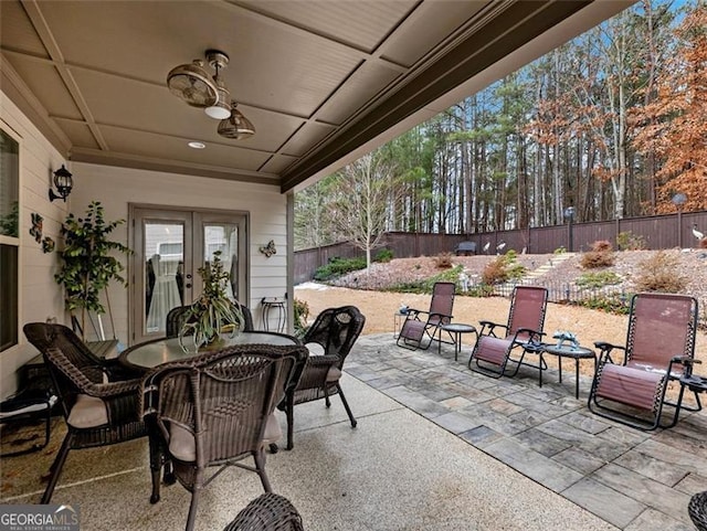 view of patio featuring ceiling fan and french doors