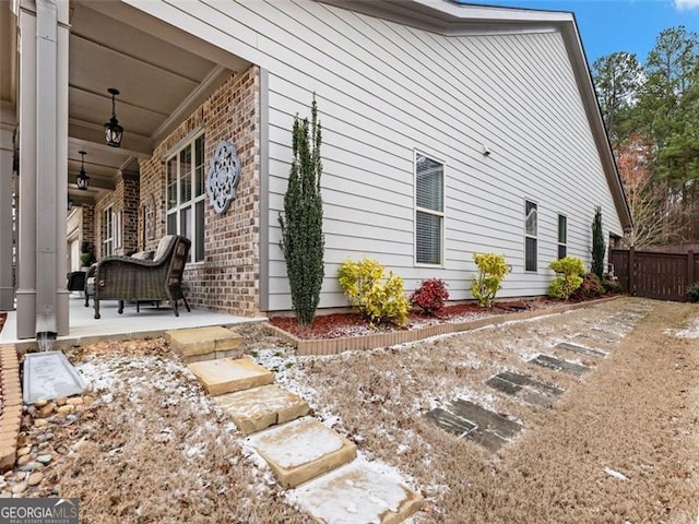 view of side of property featuring a patio