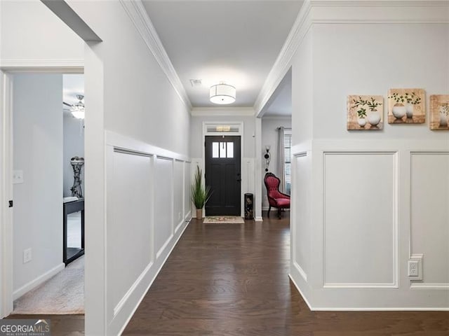 entrance foyer with crown molding, ceiling fan, and dark hardwood / wood-style flooring