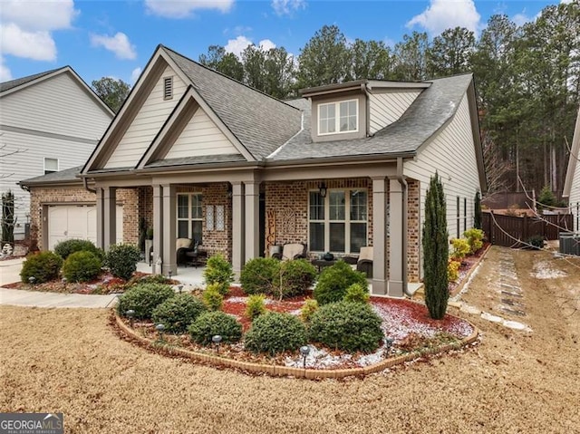 view of front of home featuring a garage and covered porch