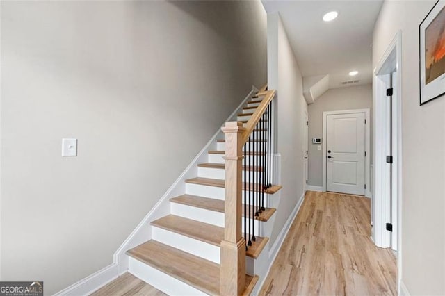 stairway with wood-type flooring