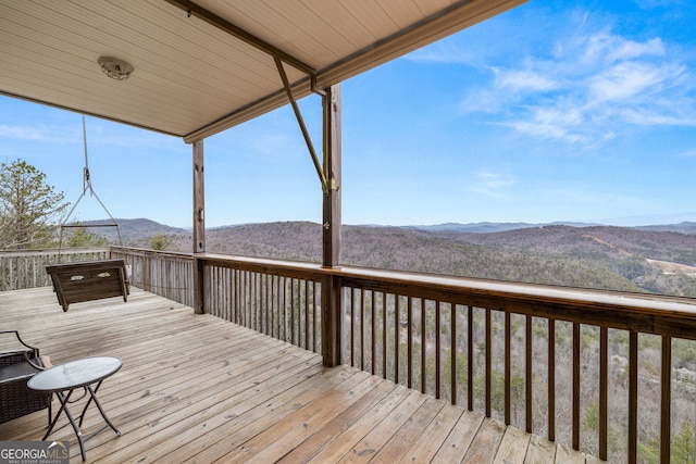 wooden terrace featuring a mountain view