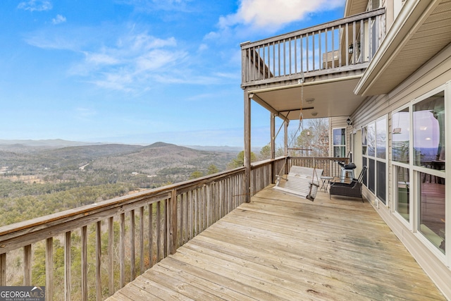 wooden terrace featuring a mountain view