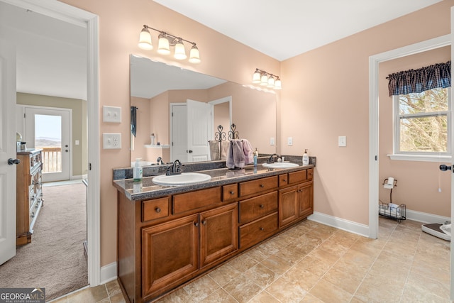 bathroom featuring vanity and a healthy amount of sunlight