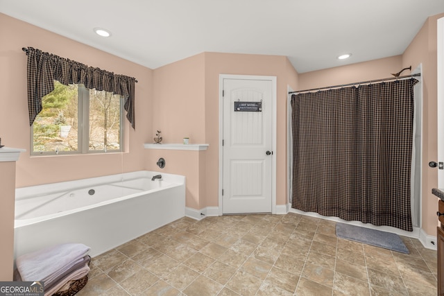 bathroom featuring plus walk in shower