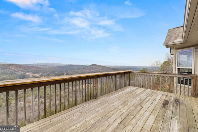 wooden terrace featuring a mountain view