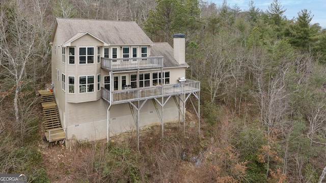 rear view of house with a balcony