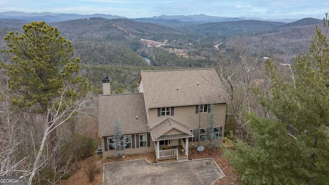 birds eye view of property with a mountain view