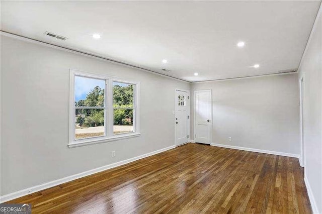 empty room with dark hardwood / wood-style floors