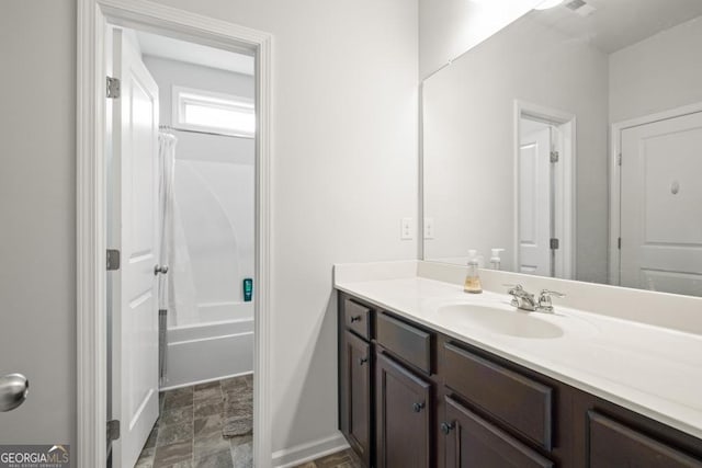 bathroom featuring shower / bath combination with curtain and vanity