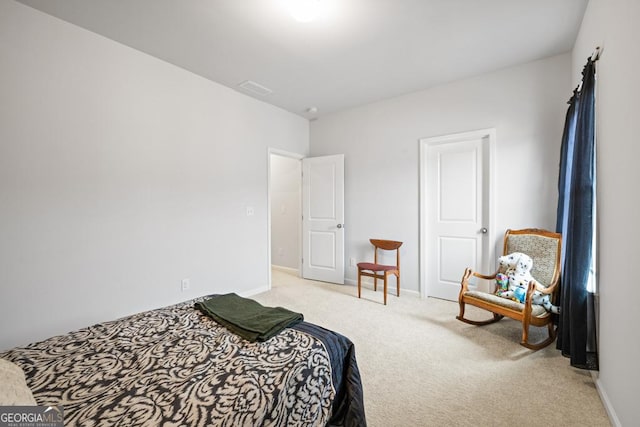 bedroom featuring light colored carpet