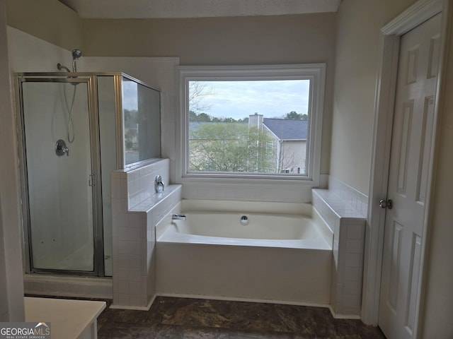 bathroom with shower with separate bathtub