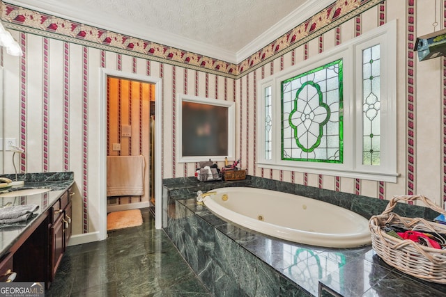 bathroom featuring crown molding, vanity, tiled bath, and a textured ceiling