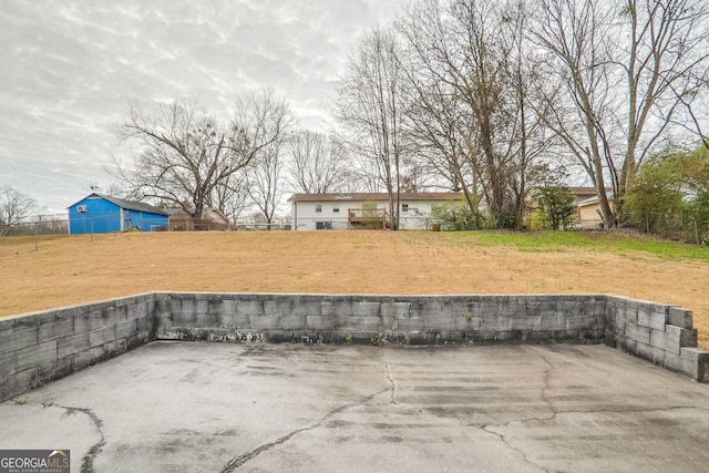 view of patio featuring fence