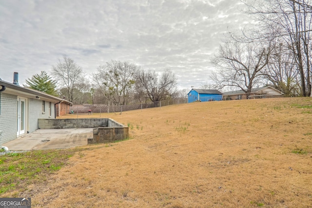 view of yard with a patio area and a fenced backyard