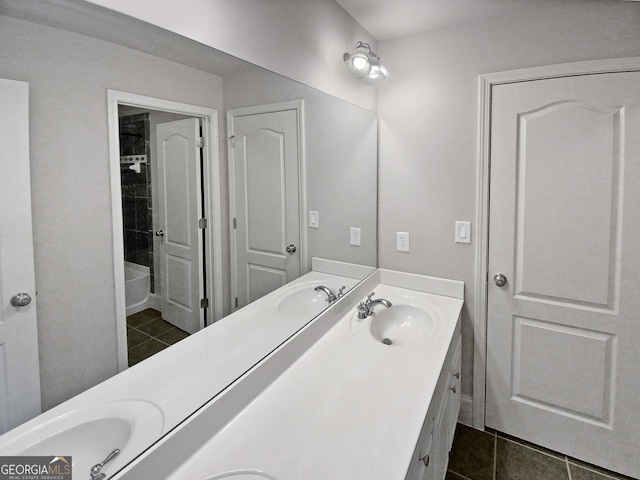 bathroom with tile patterned flooring and vanity