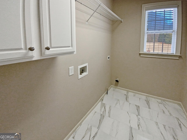 laundry room with washer hookup, electric dryer hookup, and cabinets