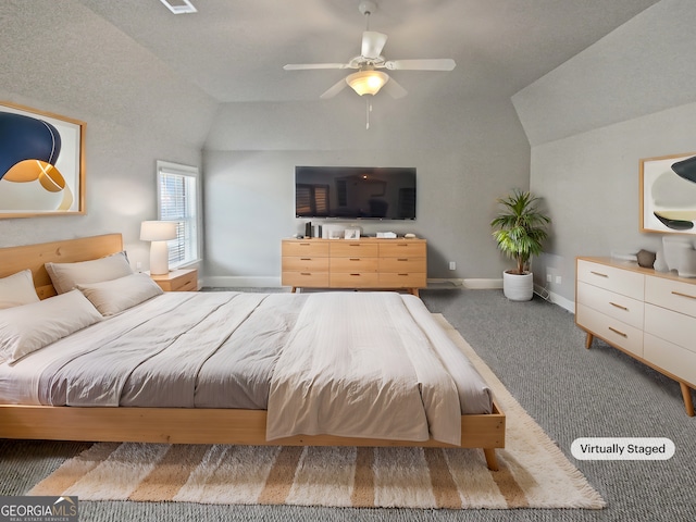 carpeted bedroom featuring vaulted ceiling and ceiling fan