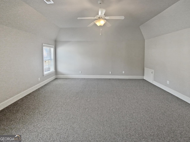 additional living space featuring vaulted ceiling, ceiling fan, and carpet