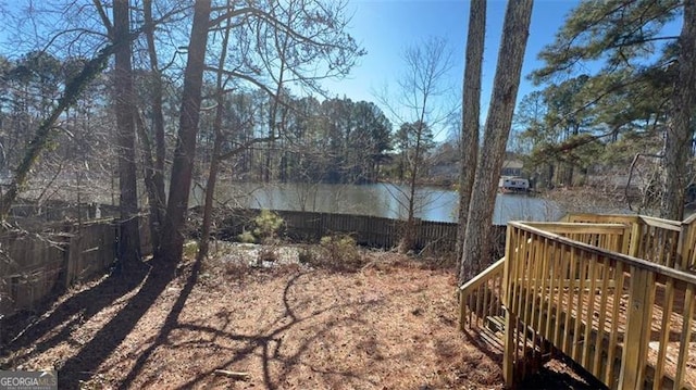 view of yard featuring a deck with water view