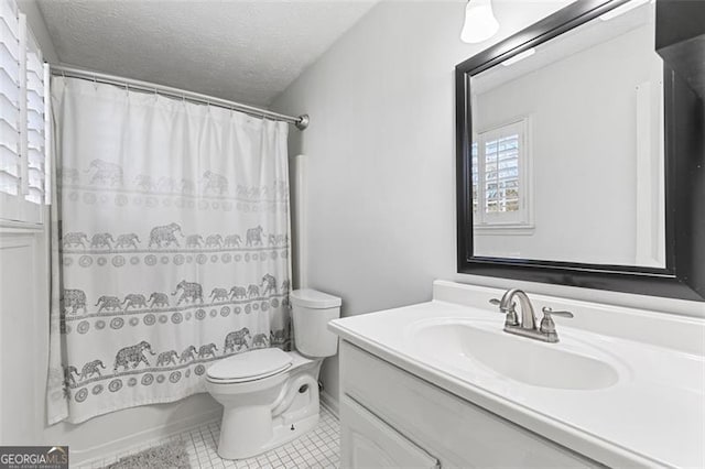 bathroom with vanity, toilet, tile patterned floors, a textured ceiling, and a shower with shower curtain