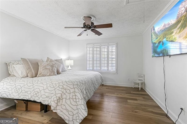 bedroom with wood-type flooring, crown molding, a textured ceiling, and ceiling fan