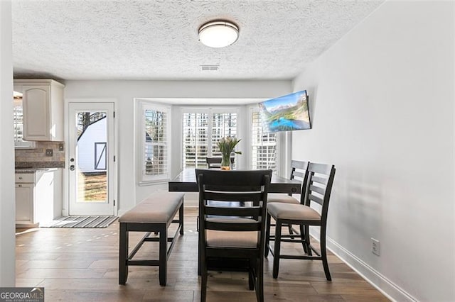 dining room featuring dark hardwood / wood-style floors