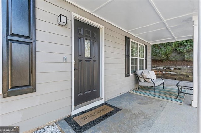 property entrance featuring covered porch