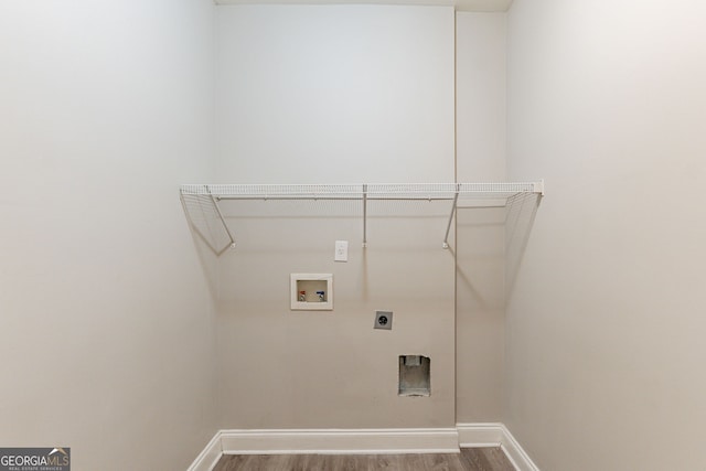 laundry area featuring hardwood / wood-style flooring, hookup for an electric dryer, and washer hookup