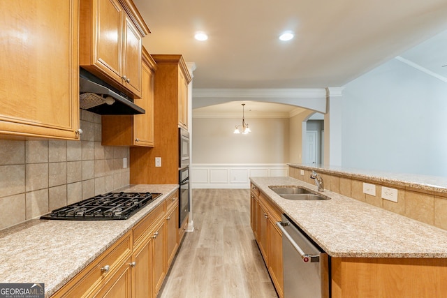 kitchen with sink, ornamental molding, stainless steel appliances, light stone countertops, and light hardwood / wood-style flooring