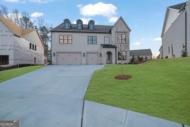 view of front of house featuring a garage and a front yard