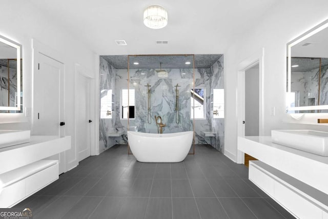 bathroom featuring vanity, independent shower and bath, and tile patterned flooring