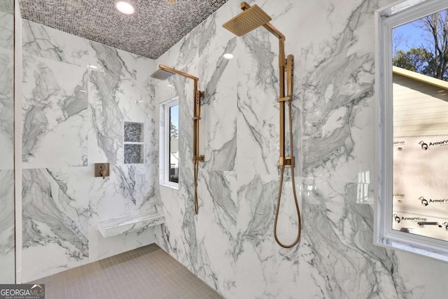 bathroom featuring tiled shower