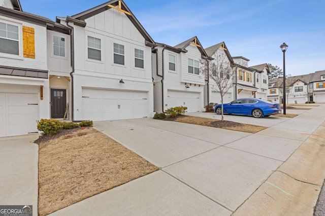 townhome / multi-family property featuring a garage