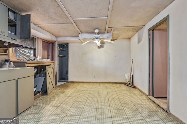 kitchen featuring tasteful backsplash and ceiling fan