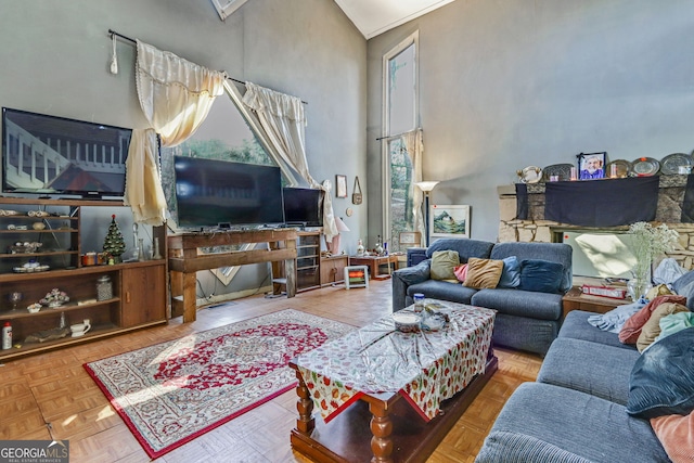 living room with parquet floors and a high ceiling