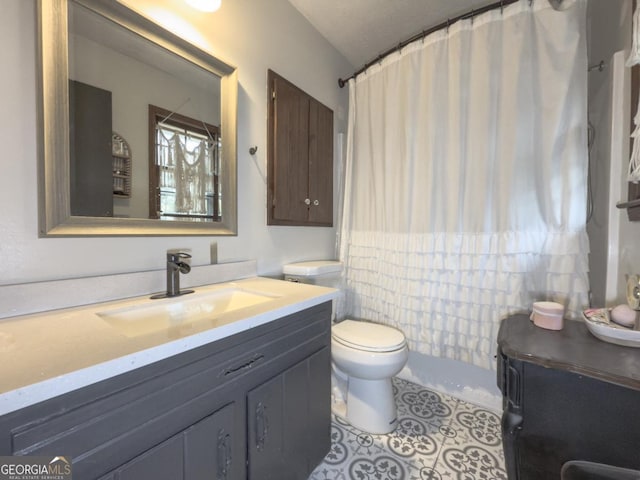 bathroom with vanity, tile patterned flooring, toilet, and a shower with shower curtain