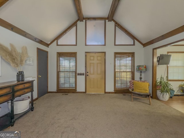 interior space with high vaulted ceiling, beam ceiling, and carpet floors